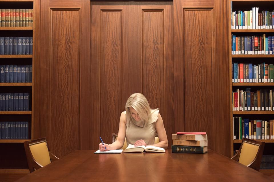 Danielle Curtis at desk doing research